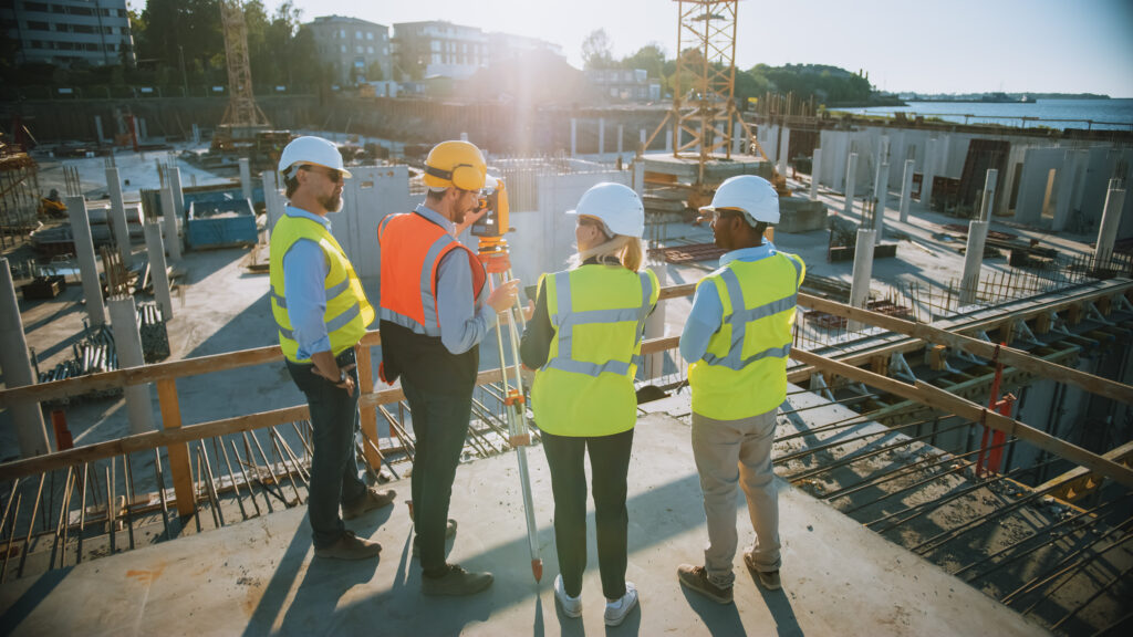 Construction Worker Using Theodolite Surveying Optical Instrumen